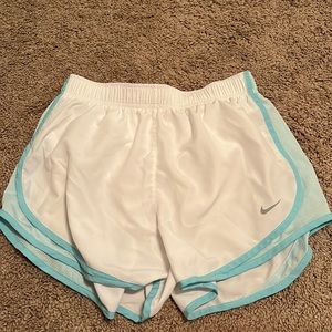 white and blue nike shorts